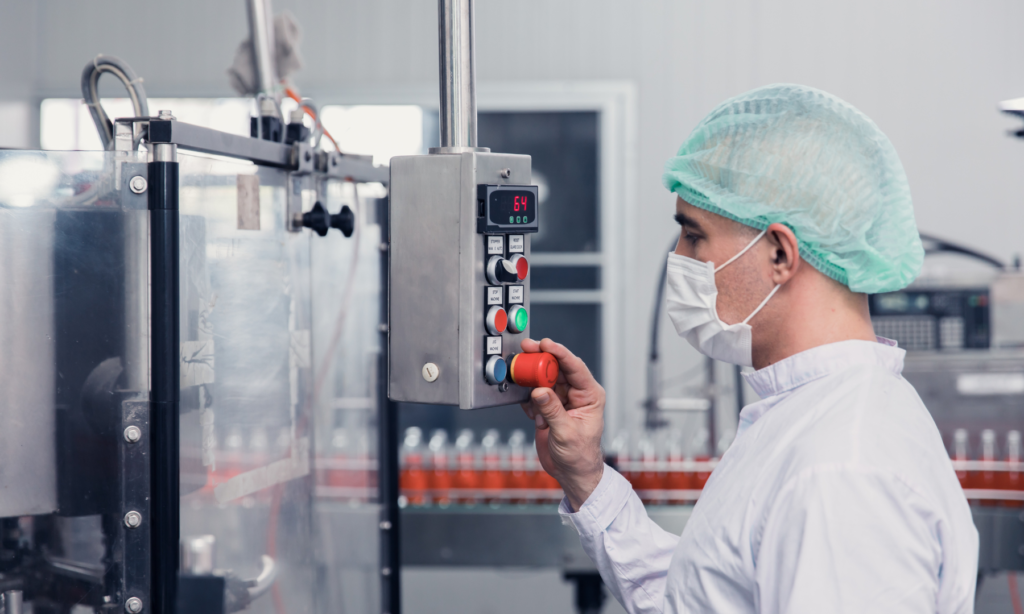 Image shows an engineer in an eco-friendly uniform in a laboratory adjusting a control unit as part of an Advancing Circular Economy in a Biomass Refining project.